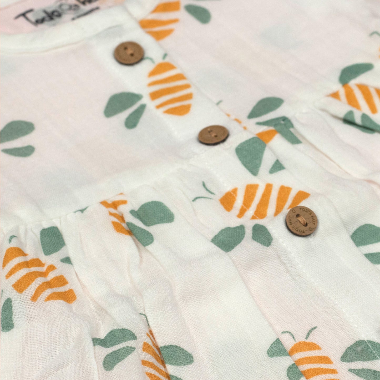 Premium Tod’s Hut Sweet Bee Frock – Soft White Muslin Dress with Charming Buzzing Bee, Perfect for Sunny Adventures!