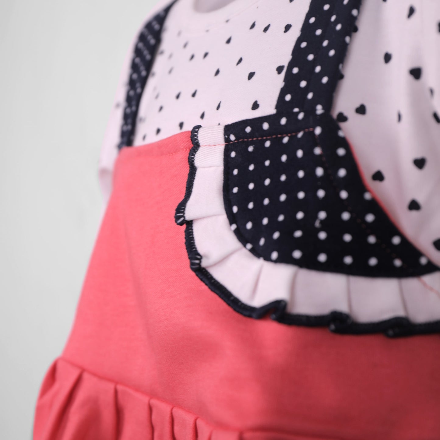 Brighten her day in Piu’s red frock—embroidery, 3/4 sleeves, and comfy leggings!