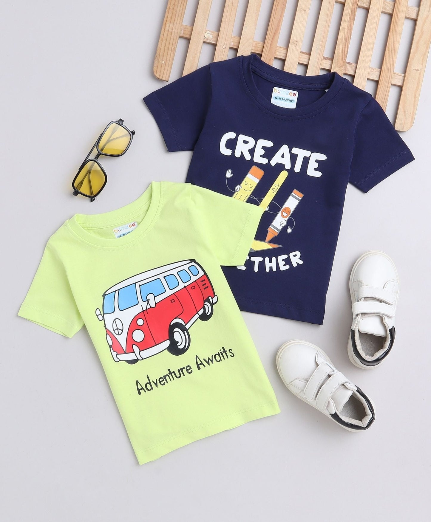 Adventure awaits in Bumzee’s boys’ 2-pack tees—navy and neon green with bold prints!
