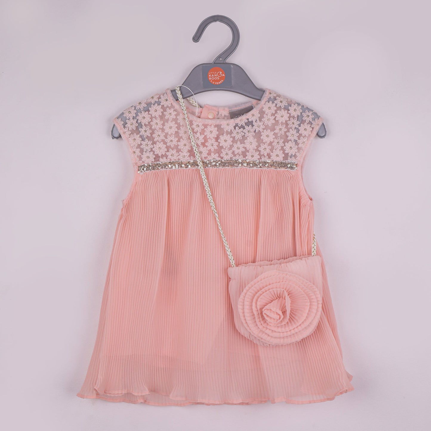 Elegant Peach – Girls’ Sleeveless Frock with Matching Sling Bag
