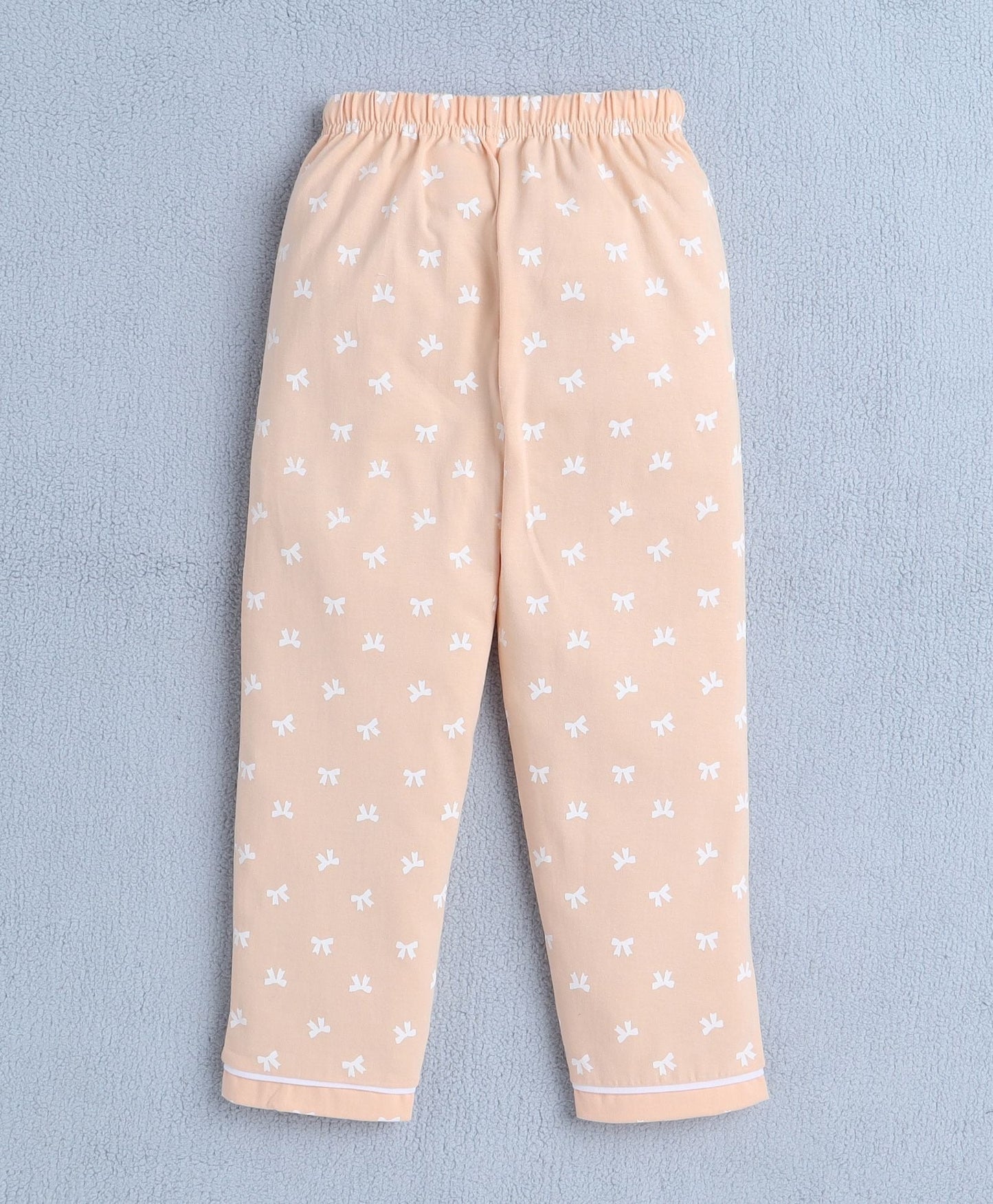 Slip into warmth with Bumzee’s peach pyjama set—drawstring waist and front button top!