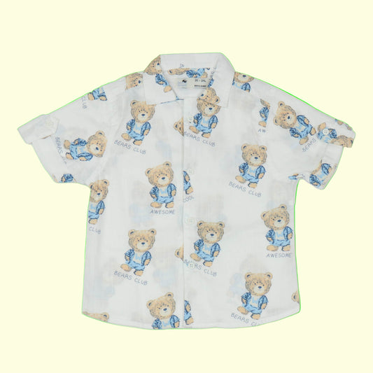 Children's shirt with teddy bear pattern on a light yellow background