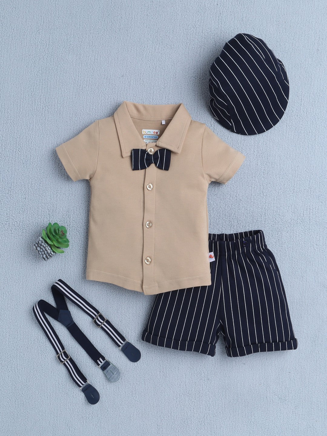 Bumzee’s boys’ festive set: half-sleeve polo, elastic shorts, and cap with cute bow accents!