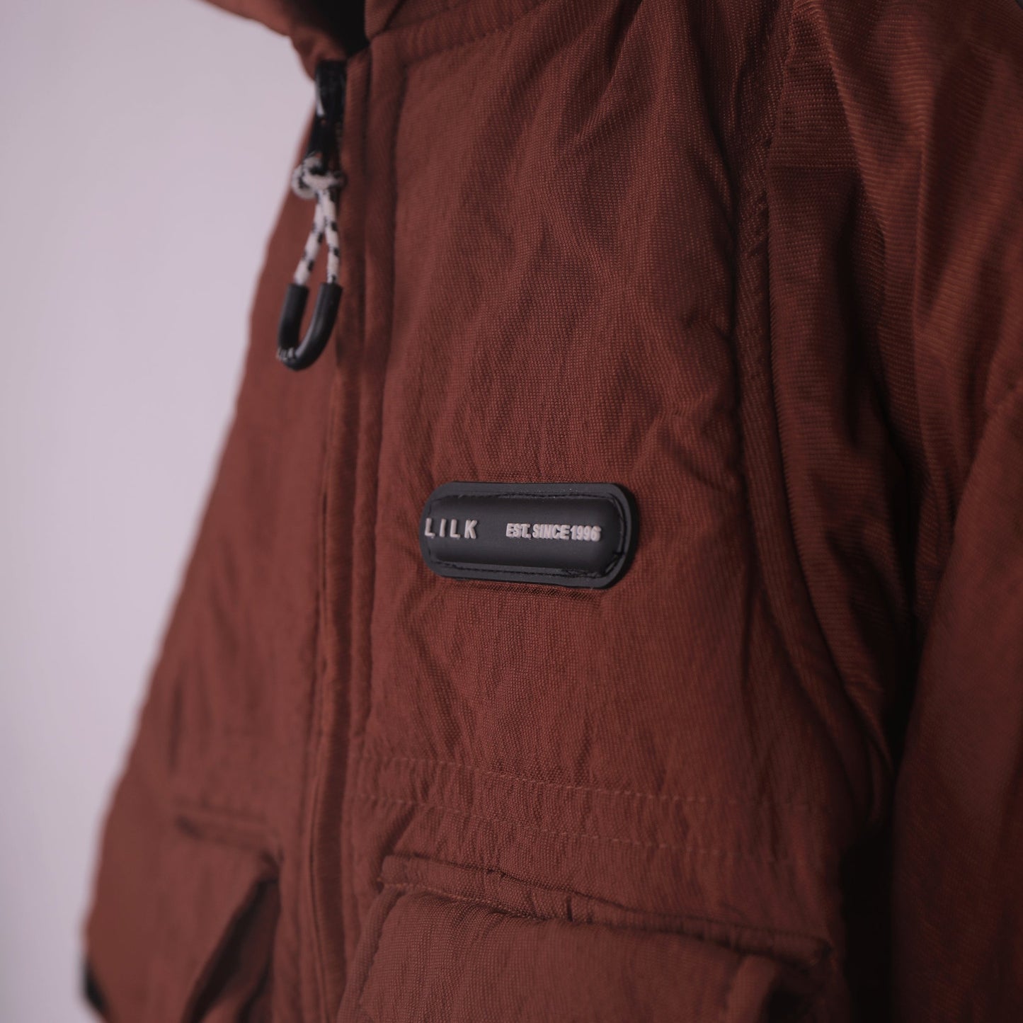 Stay Toasty in Rust Orange: Little Kangaroos Boys Quilted Hooded Jacket with Zip Closure